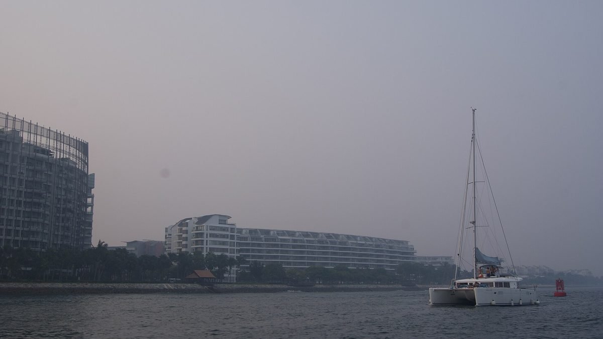 Private sailing yacht on the water at Sentosa Cove, Singapore